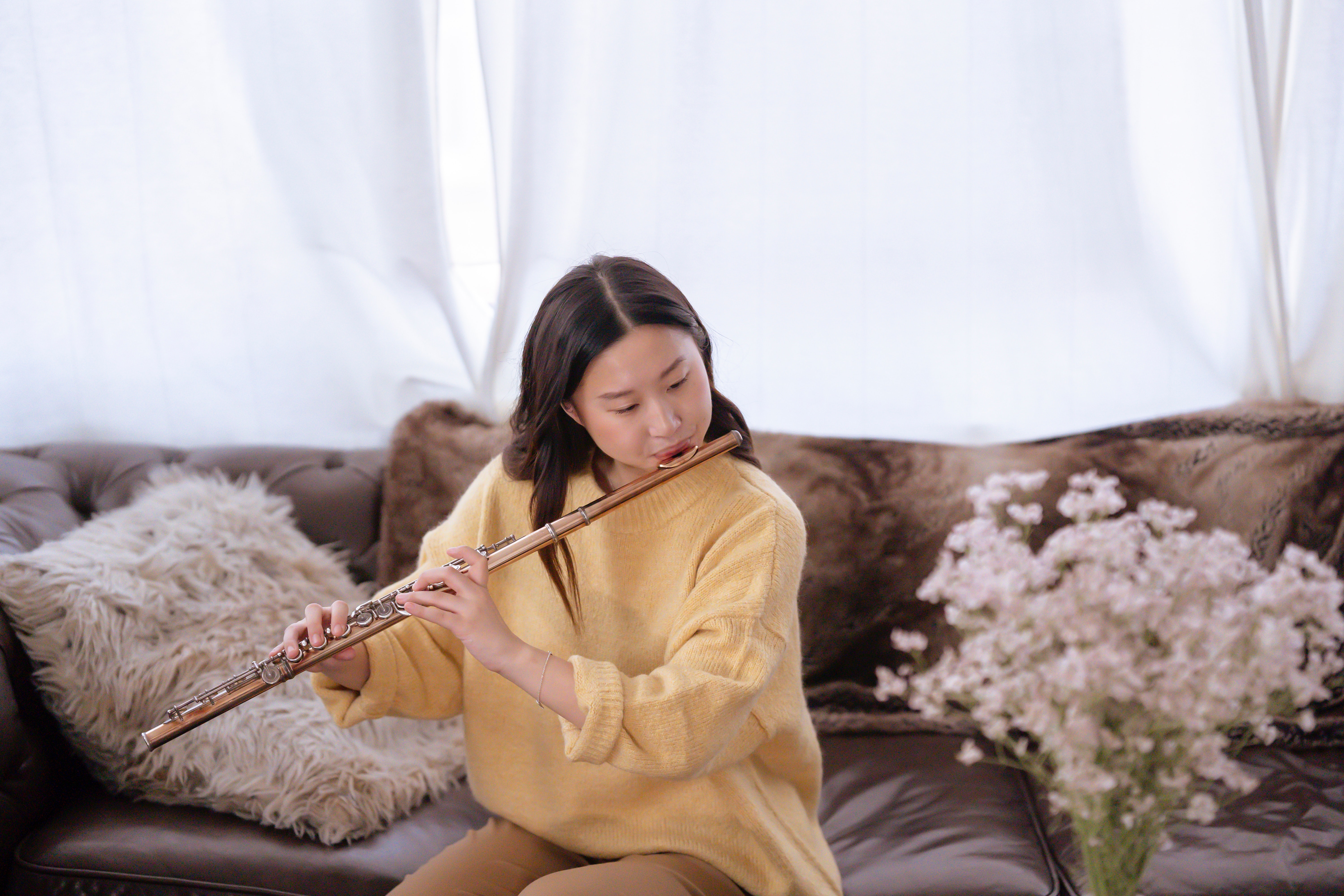 gradation of tone - young girl playing the flute